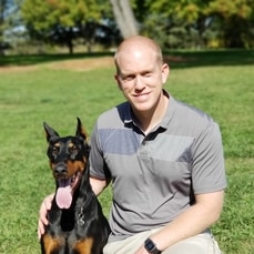 John Walter and Cooper, his Doberman Pinscher.